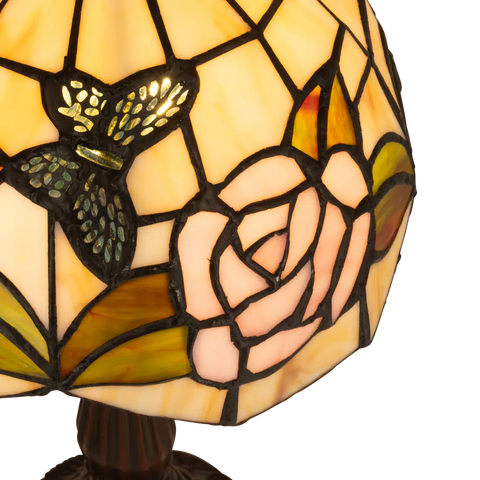 Detail Tiffany tafellamp bloemen en vlinders van glas in lood in crème-, roze- en geeltinten