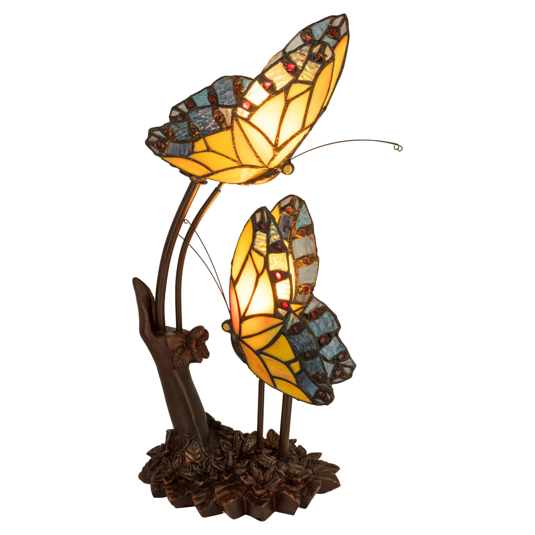 Roruvera Tiffany vlinderlamp met twee vlinders van glas in lood in geel- en blauwtinten op bloemrijke voet, brandend