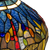 Detail Tiffany tafellamp libellen met verlichte voet van glas in lood in blauw-, amber- en roodtinten