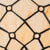 Detail Tiffany wandlamp ruitpatroon met ronde glasaccenten van glas in lood in witte-, crème- en ivoortinten