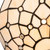 Detail Tiffany wandlamp ruitpatroon met ronde glasaccenten van glas in lood in witte-, crème- en ivoortinten