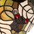 Detail Tiffany wandlamp herfst en bladeren van glas in lood in groen-, bruin- en crèmetinten