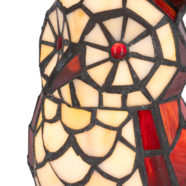 Detail Tiffany uillamp met bronskleurige voet in boomstronkvorm van glas in lood in rood,- en cremetinten
