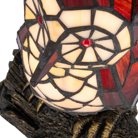 Detail Tiffany uillamp met bronskleurige voet in boomstronkvorm van glas in lood in rood,- en cremetinten