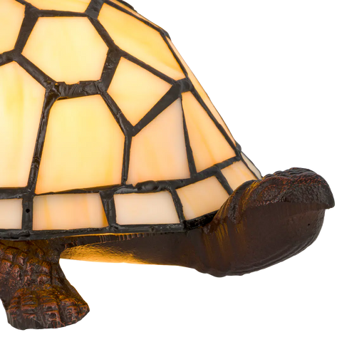 Detail Tiffany schildpadlamp met bronskleurige voet van glas in lood in crème glas-in-lood schild