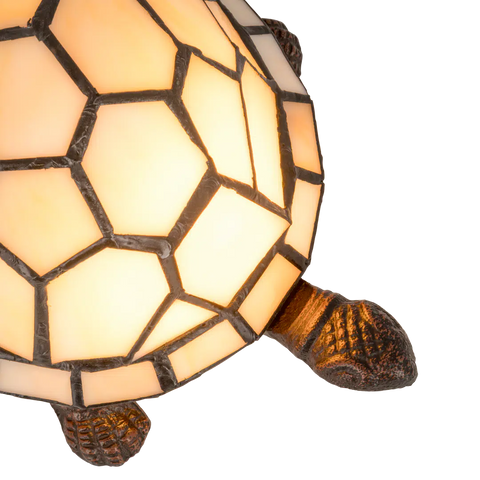 Detail Tiffany schildpadlamp met bronskleurige voet van glas in lood in crème glas-in-lood schild