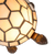 Detail Tiffany schildpadlamp met bronskleurige voet van glas in lood in crème glas-in-lood schild