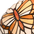 Detail Tiffany wandlamp vlinder van glas in lood in beige,- en bruintinten